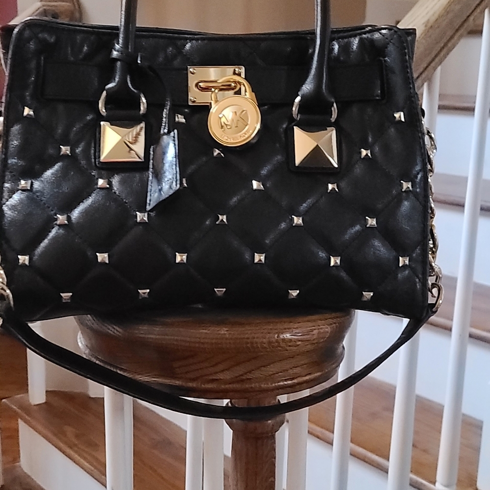 Michael Kors black hand bag with quilt design and gold studs